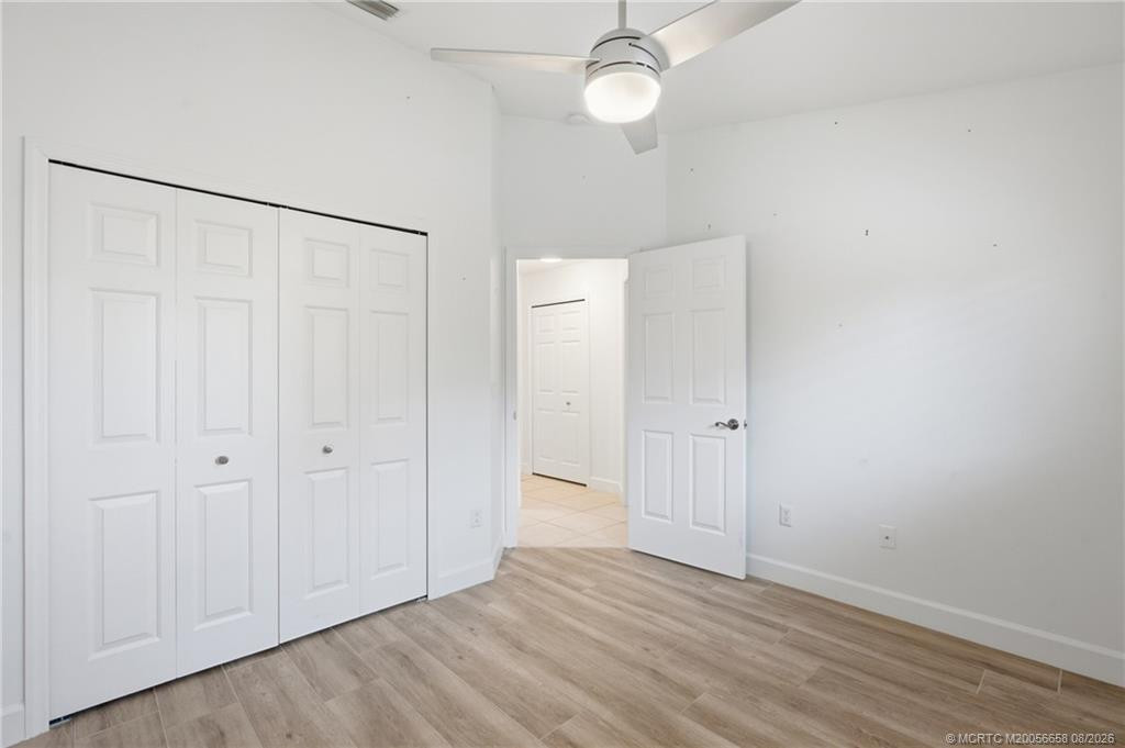 3rd Bedroom: large space with luxury vinyl plank flooring and views of green space.