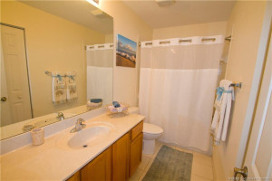 Upstairs hall bath has a shower over the tub. The large linen closet adds to the storage area