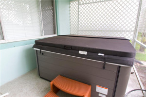 Recently purchased heated spa is included. The spa has multicolored lights and added features.