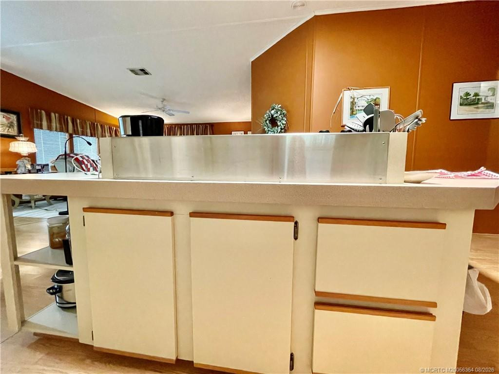 Kitchen island with smooth surface cooktop & extra cabinets