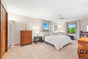 Primary suite with two walk in closets.