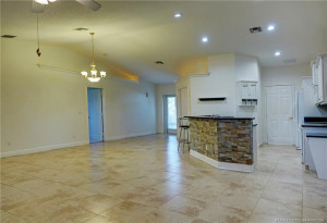 Great room toward kitchen, dining and entry