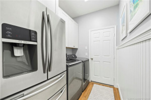 Laundry Room w/ extra refrigerator