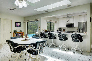 Snack bar into kitchen with additional eating space