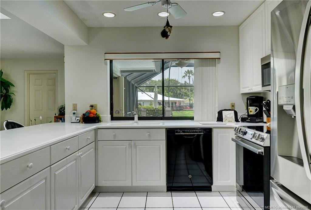 Kitchen to pool view, family room to left