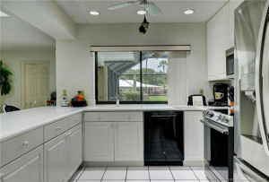 Kitchen to pool view, family room to left