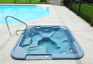 Hot tub within screened patio area