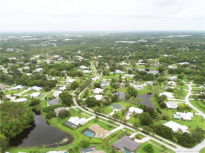Aerial rear of house at NE side of pond