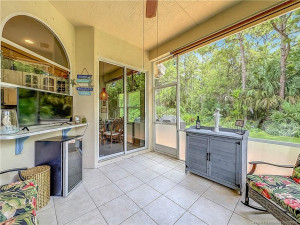 SCREENED, FAN, PASS THROUGH FROM KITCHEN TO ENJOY, 2 SLIDERS ONE TO KITCHEN AND LIVINGROOM , ALL TILED.