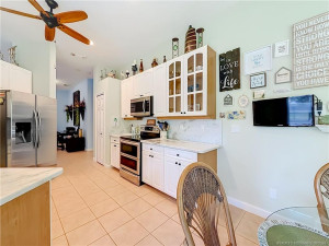 ALL TILED AND EAT IN KITCHEN AREA. YES, THAT IS A DOUBLE OVEN TOP CONVENSTION. GRANITE COUNTER ARE SO THICK AND BEAUTIFUL.