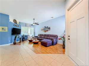 NICE OPEN CONCEPT .. TILE AND LAMINTE FLOORING, NEW FRONT DOOR 2026. KITCHEN BEHIND THE BLUE WALL.