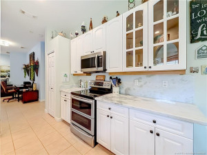 DOUBLE OVEN CONVENSTION AND REGULAR, SMOOTH TOP , MICRO WAVE, GRANITE COUNTERS BEAUTIFUL. SLIDER OUT TO THE PATIO WITH PASS THROUGH FROM THE SINK AREA TO OUT ON THE PATIO, EAT IN KITCHEN