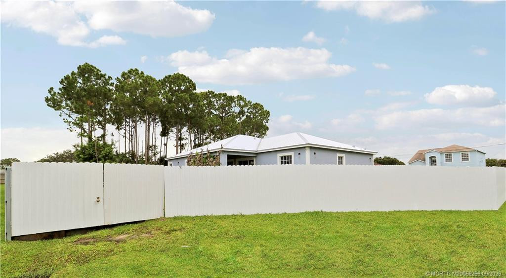6' metal PRIVACY fence with two 12' wide gates.