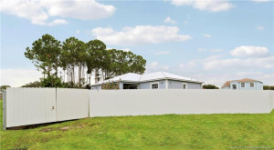 6' metal PRIVACY fence with two 12' wide gates.