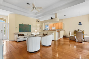 Living area toward kitchen and dining