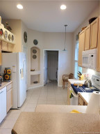 Kitchen to laundry room and garage