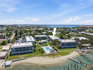 Aerial view with arrow identifying the building within the waterfront community.