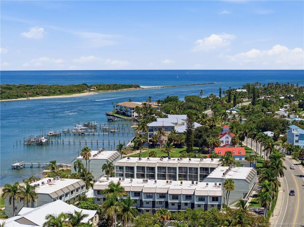 Elevated aerial perspective showcases the community’s location along the water with the Fort Pierce Inlet and Atlantic Ocean beyond.
