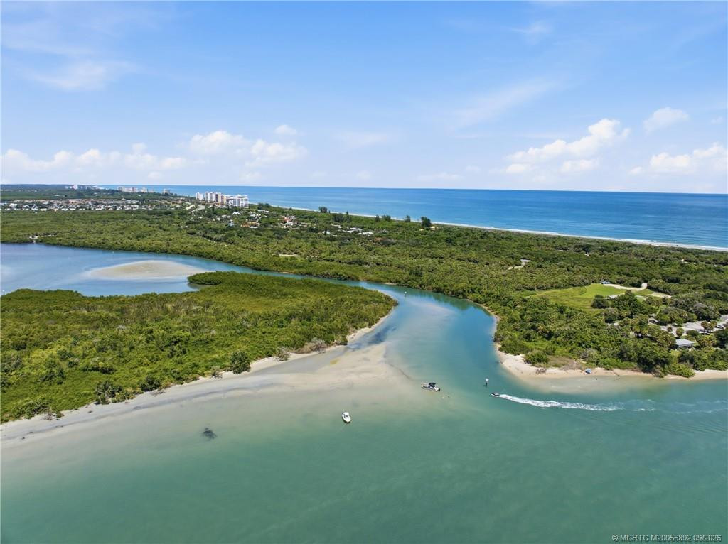 Aerial view of the natural waterways and shoreline near the Fort Pierce Inlet with the Atlantic Ocean beyond.