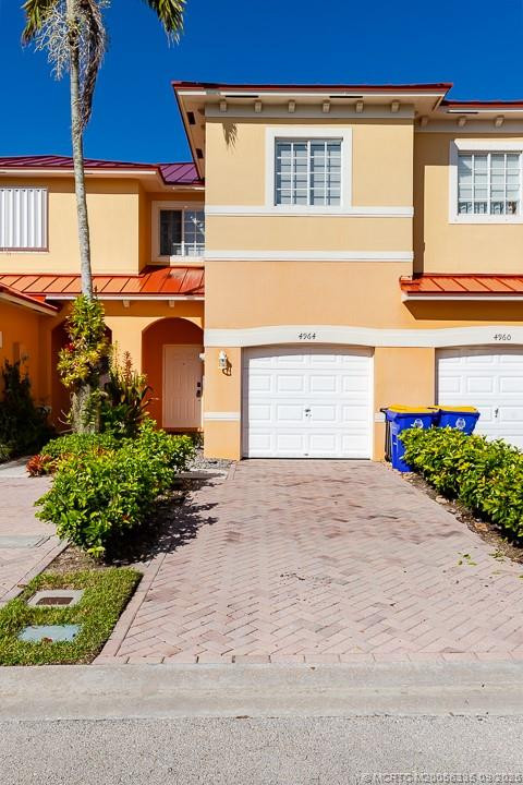Nicely landscaped paver driveway at 4964 SE Mariner Garden Circle, Stuart
