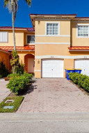 Nicely landscaped paver driveway