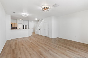 Open floor plan with new LVP (luxury vinyl plank) flooring throughout downstairs.