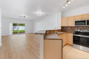 Open view from kitchen with all new stainless-steel appliances