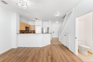 Entry, Kitchen, Dining Area, 1/2 Bath and storage closet under the stairs. All new LVP flooring throughout downstairs with upgraded ceiling light fixtures.