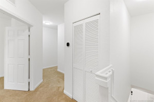 Hallway at the top of the stairs leading past the en suite master bedroom to the other two bedrooms and guest bath. 5 Ton A/C unit in hall closet. New Ecobee thermostat.