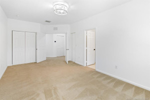Large MBR with double door entry has upgraded ceiling light, two closets and en suite bathroom. Plush carpeting recently cleaned.