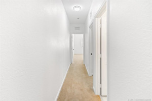 2nd floor carpeted Hallway to BR 2 & 3 and Guest Bathroom. Updated ceiling light fixture.