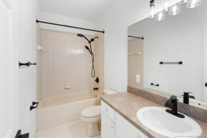 All new matching plumbing hardware, towel bars and door handle. New lighting fixture.