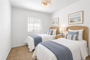 Virtually staged photo. Sweet dreams for the kids! Upgraded ceiling light with fan.