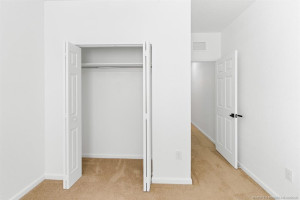 Guest BR closet updated with new hanging rod and shelf. New door handle.