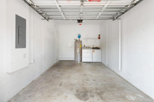 Nice and clean one-car garage with A.O. Smith water heater and new Whirlpool washer and dryer, less than 1 year old.