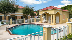 Fenced Community Pool with bathrooms and shady area to sit and relax