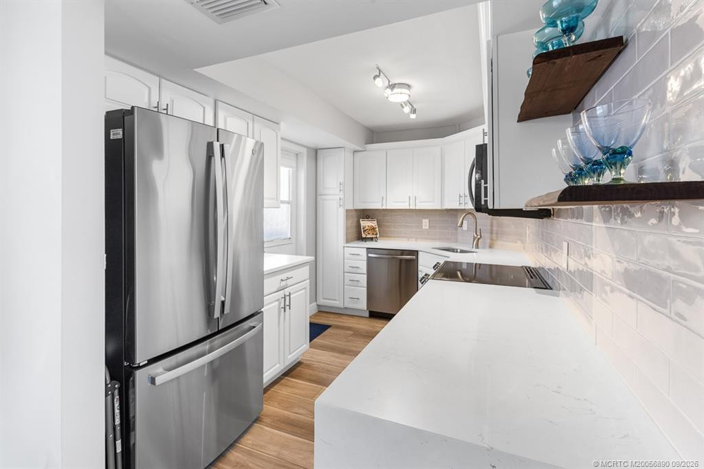 Updated kitchen with waterfall quartz