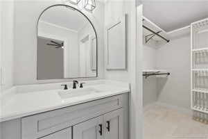 View of Vanity and Walk-In Closet