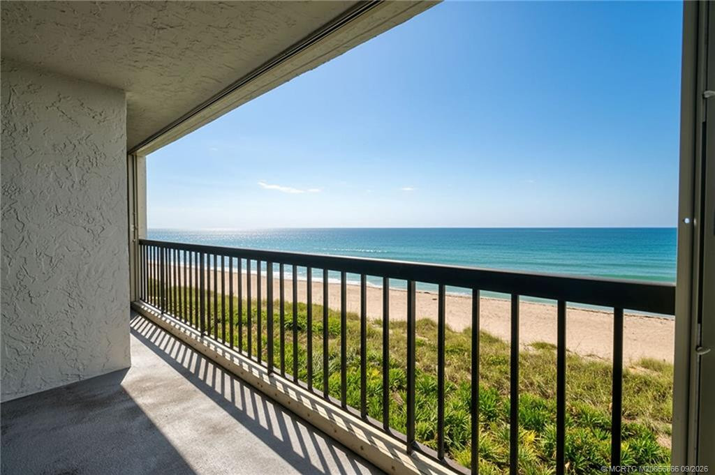 Expansive oceanfront balcony offering a front-row view of the beach and Atlantic Ocean.
