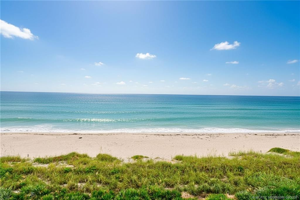 Direct Atlantic Ocean view with sandy beach and natural dune landscape.