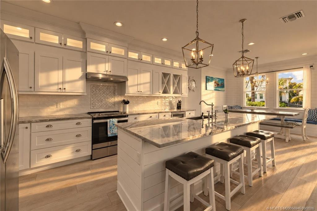 Stunning Kitchen with Large Island is a Chefs Kiss