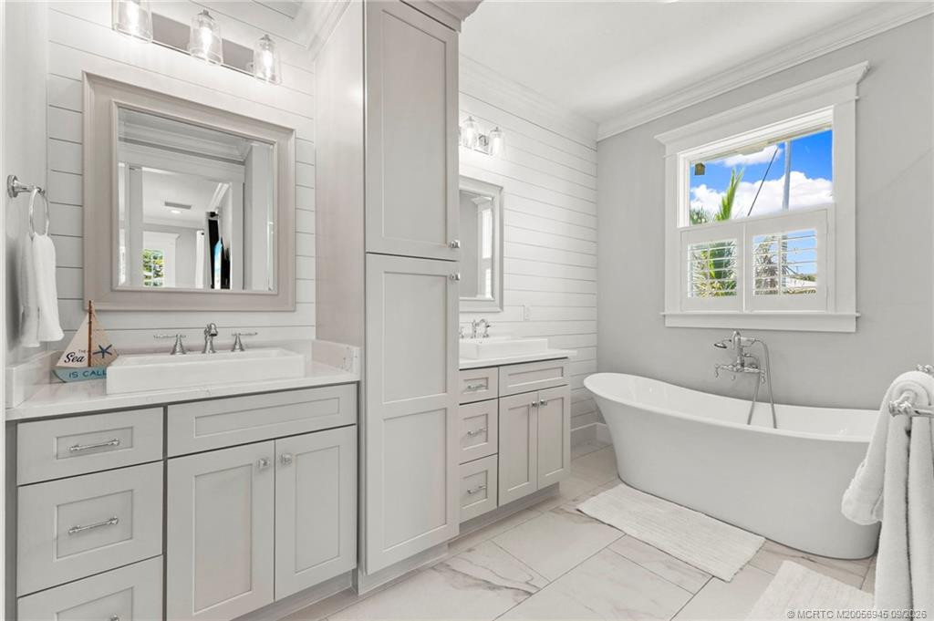 Primary Bathroom with Dual Sinks and Stunning Tub