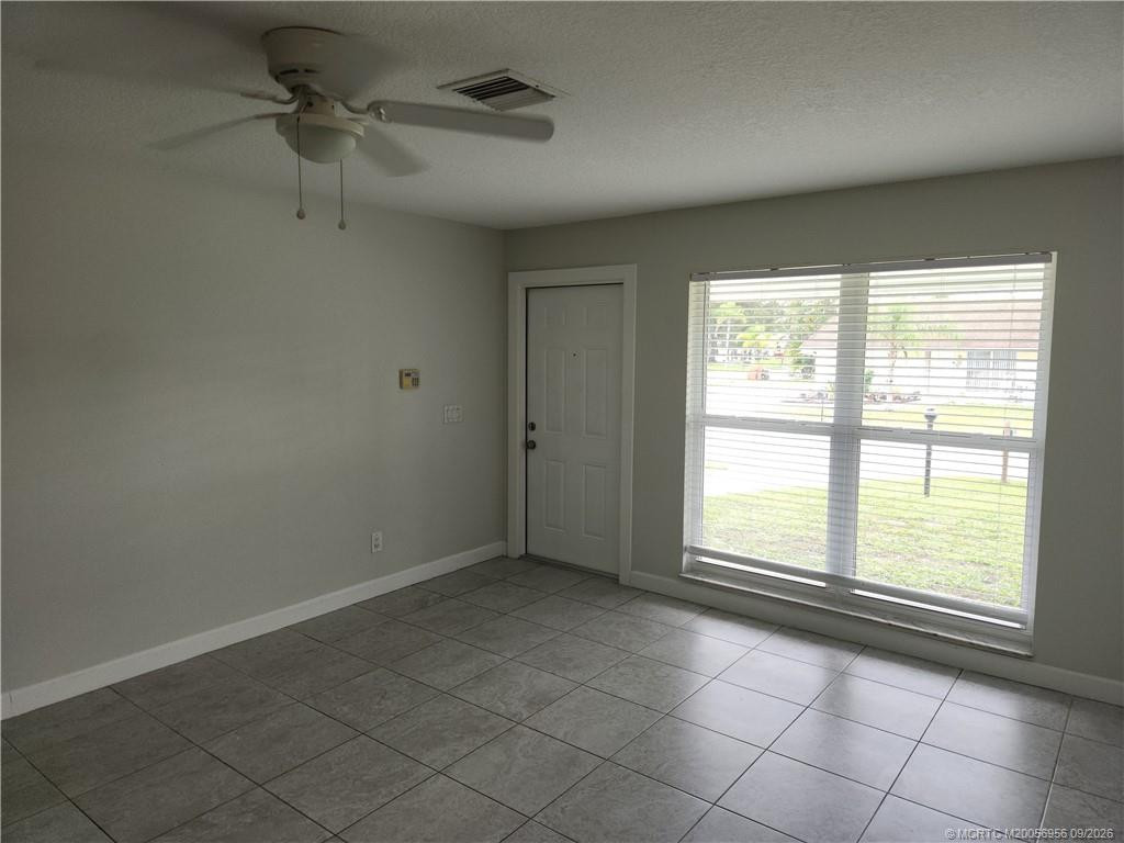 Tile floors & windows galore at 4398 SE Hamilton Lane, Stuart