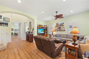 Family room off kitchen with stairs going up to 2nd level