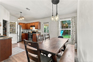 Dining space with table seating and pendant lighting