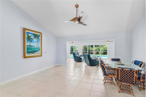 Large open Great Room, with views to large heated pool and spa