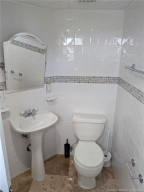 GUEST BATHROOM WITH A TUB AND SHOWER.