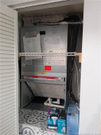 AC UNIT AND HOT WATER HEATER.