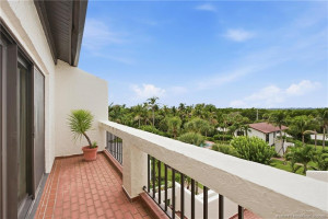 Outdoor terrace off the guest suite overlooking the lush tropical grounds, adding even more private outdoor living space.