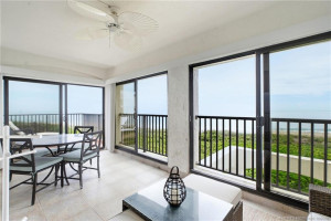 Spacious enclosed lanai provides an incredible place to dine or relax while enjoying direct ocean views.